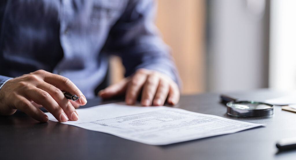 A man signing papers